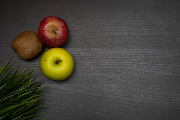 fresh fruit on dark wooden table representing healthy food