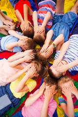 Kids taking a break relaxing on the floor