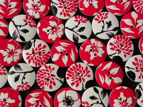 Full Frame View Of Circular Buttons With Floral Pattern