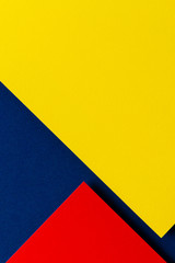 Abstract colored paper texture background. Minimal geometric shapes and lines in blue navy, red and yellow colours - obrazy, fototapety, plakaty