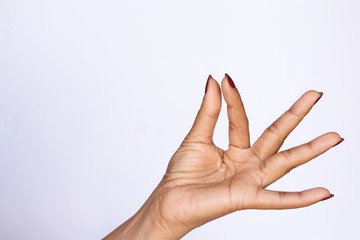 Naklejka premium Woman hand red nail polish gesture showing or holding . photo isolate on white front view copy space