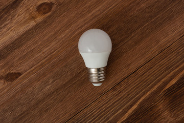 bulb on the dark brawn wood background