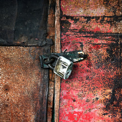Old padlock on the door of the barn
