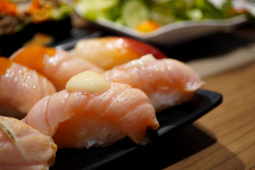 close up salmon sushi. Japanese food. Close up with blurred background.