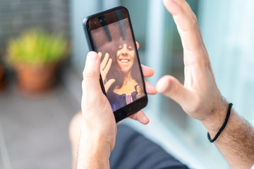 Farewell of a young woman in video call to her boyfriend in the coronavirus quarantine