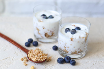 Natural granola with yogurt and blueberries, a healthy balanced breakfast