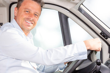 handsome man driver in van portrait of businessman driving car