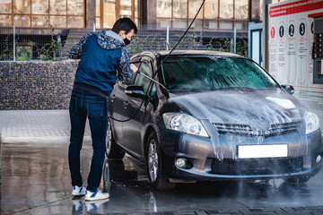 Self-service car in a car bubble wash.