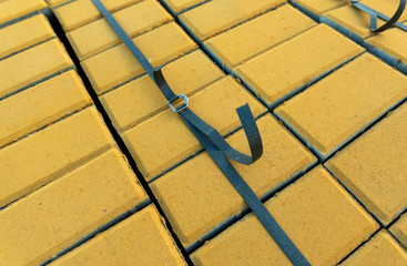 paving slabs, paving stones for laying paths, stacked in pallets or pallets