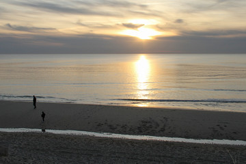 Atlantic ocean sunset on sandy tourist beach in Lacanau France