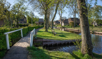 Fototapeta na wymiar Giethoorn Overijssel Netherlands. During Corona lock-down. Empty streets, paths, bridges and canals. 