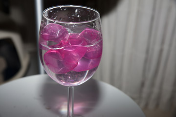  glass with ice cubes on white background