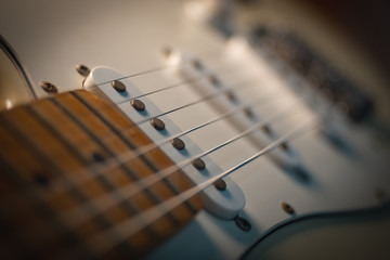 Fototapeta premium Electric guitar stratocaster closeup detail, macro abstract