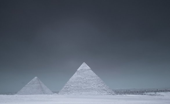 Giza Pyramids At Desert Against Clear Sky