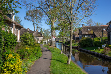 Fototapeta na wymiar Giethoorn Overijssel Netherlands. During Corona lock-down. Empty streets, paths, bridges and canals.