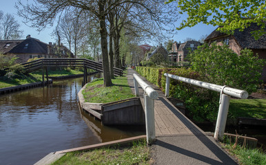 Fototapeta na wymiar Giethoorn Overijssel Netherlands. During Corona lock-down. Empty streets, paths, bridges and canals.