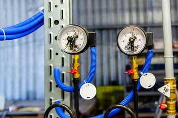 Industrial equipment with pressure gauge meters. Selective focus