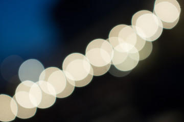Bokeh circles going from one corner to the other in cold tones.