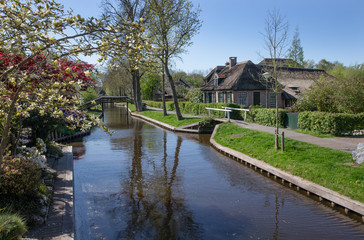 Fototapeta na wymiar Giethoorn Overijssel Netherlands. During Corona lock-down. Empty streets, paths, bridges and canals. 