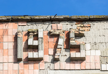 Fragment with a 1974 bas-relief from an abandoned soviet building