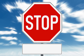 Stop sign with free text field for copy space. In the background is a dramatic sky.