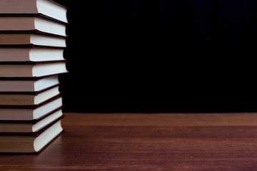 stack of books on black