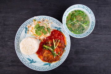  Roast, stewed in tomato sauce, served with rice and fresh salad with broth