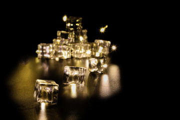 Fire flame and ice led light trough ice cube on dark black background
