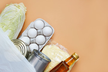 Donation food on red background close-up, copy space