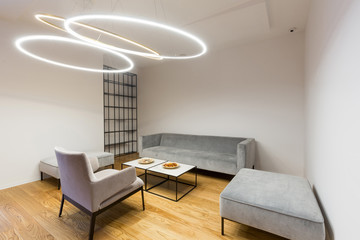 Interior of a modern hotel lounge with circular ceiling lights