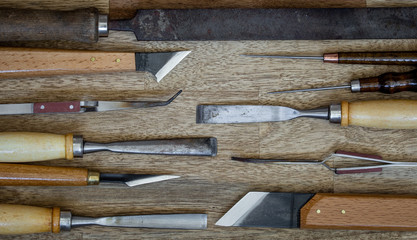 set of craft tools on wood background