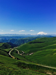 Fototapeta premium Elbrus volcano in summer from the Bermamyt plateau Russia
