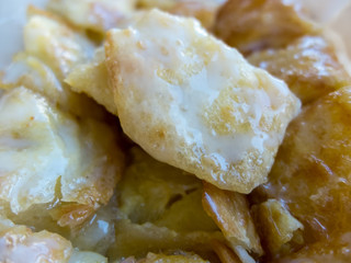 Sweet Roti with milk and sugar on paper plate
