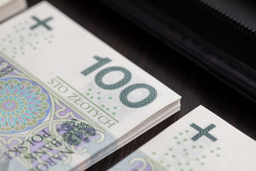 Polish paper banknotes stacked on the table, ready to start the transaction.