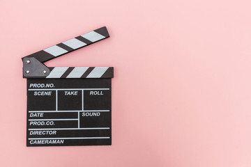 Fototapeta na wymiar Filmmaker profession. Classic director empty film making clapperboard or movie slate isolated on pink background. Video production film cinema industry concept. Flat lay top view copy space mock up.