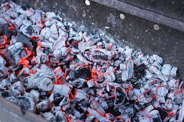 Coals for barbecue in the grill close up