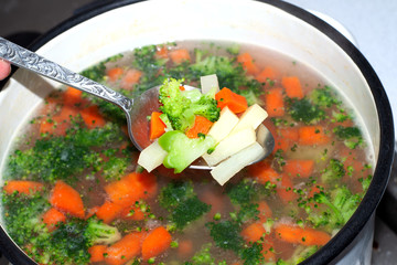 Saucepan with broccoli, carrot and potato soup