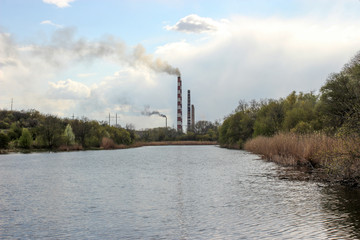 river, spillway and pipes of a thermal power plant