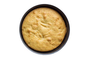 Delicious fresh baked cake in baking dish isolated on white background. Top view
