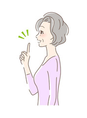 笑顔で指をさす女性の横顔