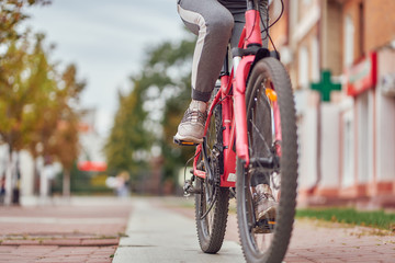 closeup bicycle in an urban environment with a woman