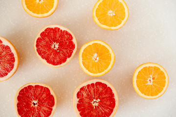 Half of grapefruit, orange, lemon cut for fresh juice. Color splash. Tropical fruits