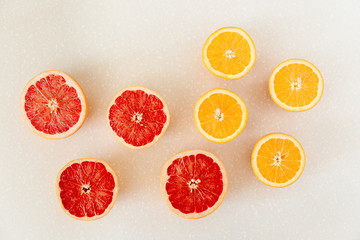 Half of grapefruit, orange, lemon cut for fresh juice. Color splash. Tropical fruits
