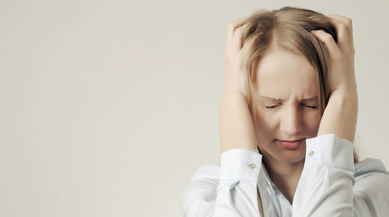 Woman with headache. girl holds her head. Stressed man concept