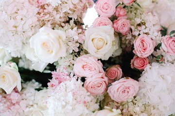 Wedding arch decorated with white flowers and flower compositions of pink and white flowers. Hydrangea.