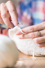 girl crocheting a rug