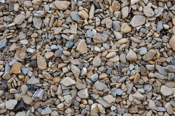 Stone path background above. Close up Wallpaper. Many stones. Stones small and large. Different size and color stones. building stone