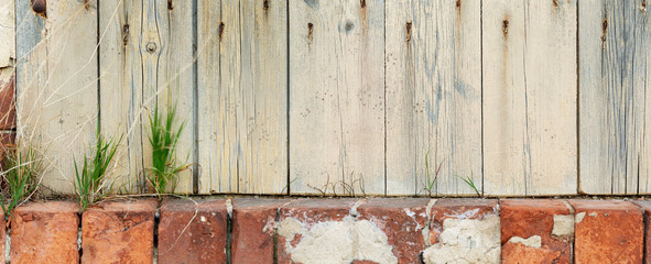window with wooden shutters and a brick coping