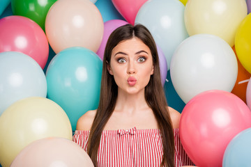 Fototapeta na wymiar Close-up portrait of her she nice attractive lovely funny girlish cheerful cheery long-haired girl sending air kiss among colorful air ball isolated on bright vivid shine vibrant blue color background