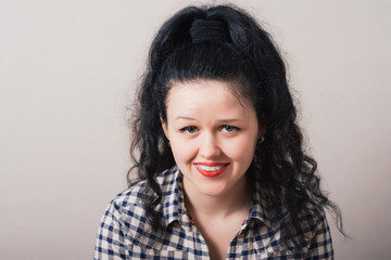 portrait of attractive  caucasian smiling woman looking at camera